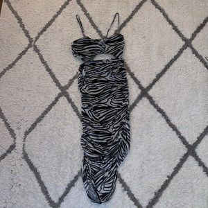 pretty little thing zebra print dress worn once with a slight tummy cutout.